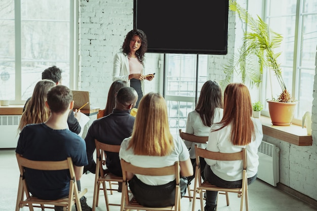 female african american speaker giving presentation hall university workshop 155003 3579